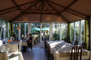 Veranda dining room at Au Fil des Saisons restaurant.